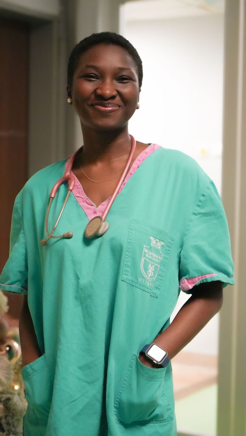 A nurse smiling in a hospital